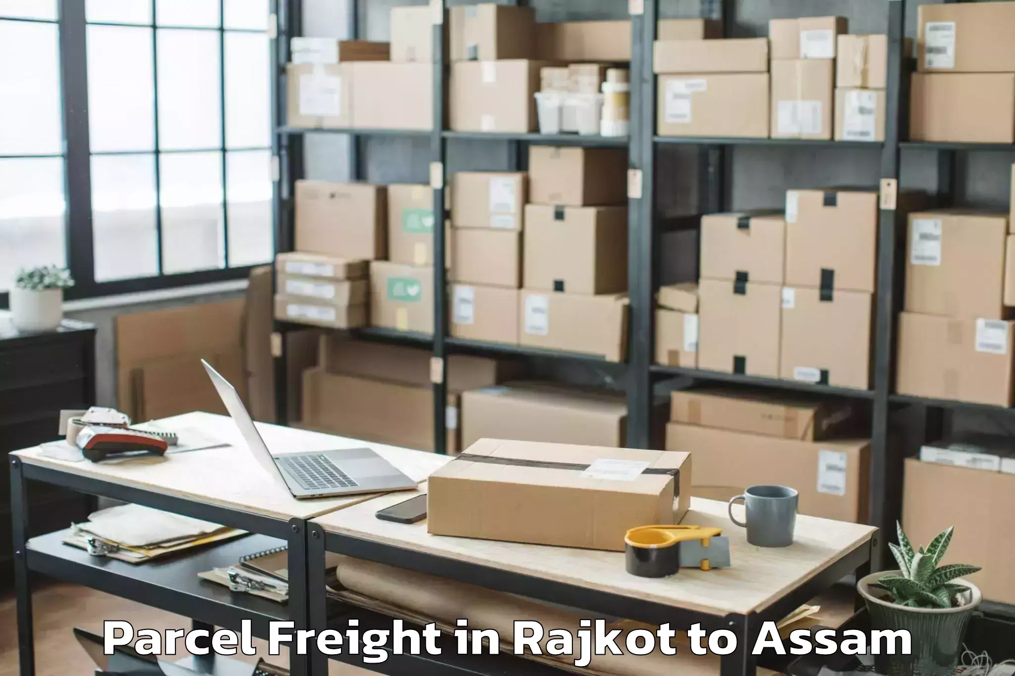 Quality Rajkot to Golokganj Pt Parcel Freight